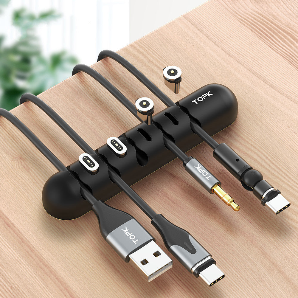 ORQAVIO Magnetic Cable Organizer silicone clips holding USB and audio cables on desk